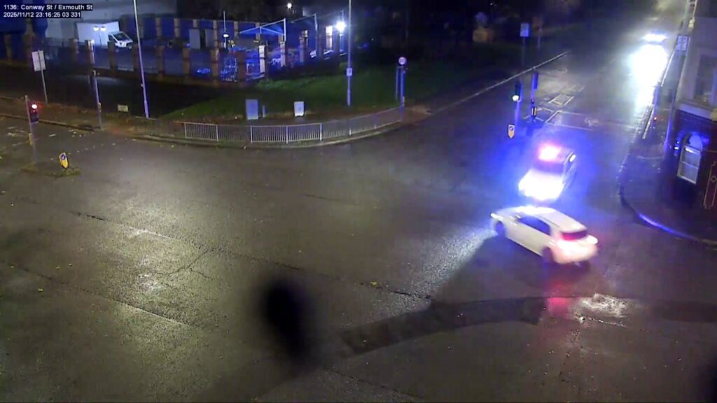 CCTV captures moment driver runs red light and police car bursts into flames - Discover SWNS