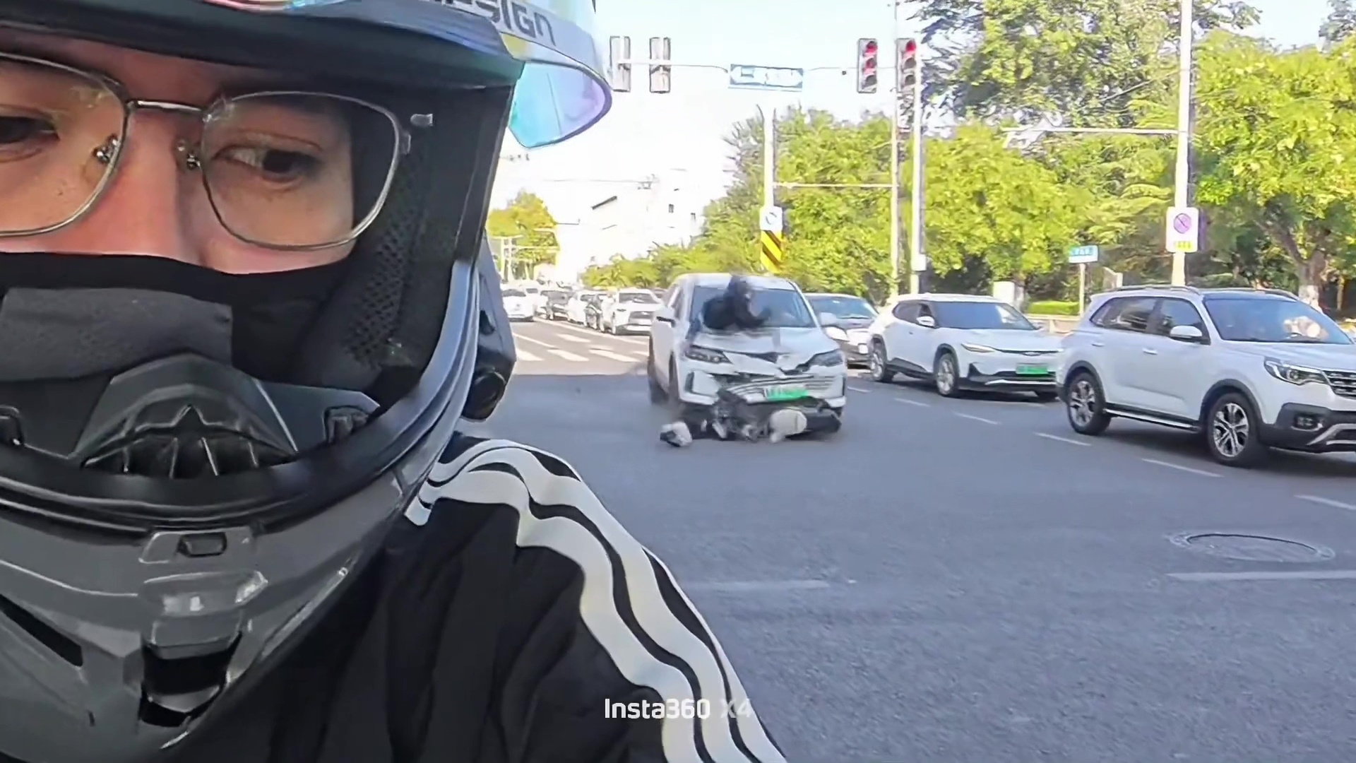 Moment e-scooter rider is sent flying after crashing into car at busy junction - Discover SWNS