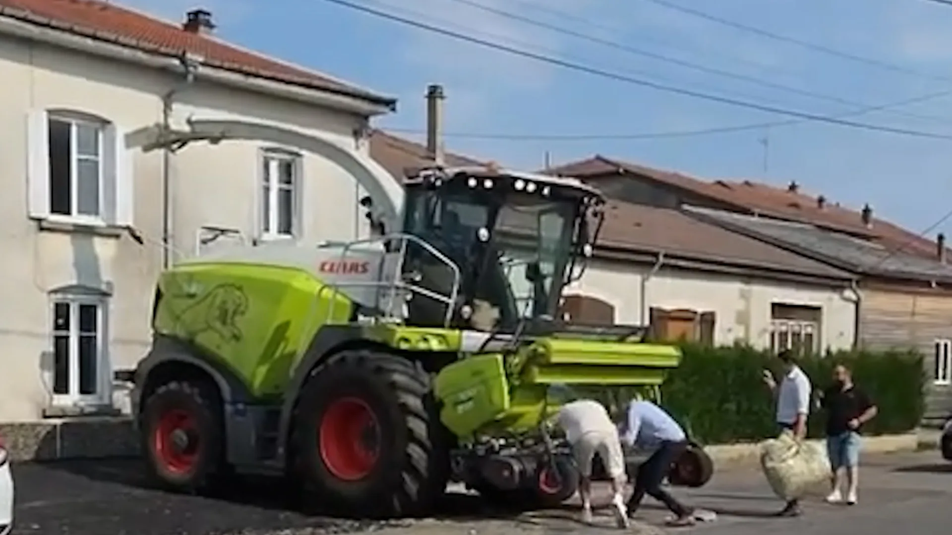 Bizarre moment wedding guests use forage harvester to blast papers through window - Discover SWNS